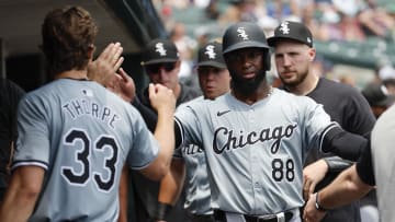 Jun 22, 2024; Detroit, Michigan, USA;  Chicago White Sox center fielder Luis Robert Jr. (88) receives congratulations from teammates after scoring in the fourth inning against the Detroit Tigers at Comerica Park. Mandatory Credit: Rick Osentoski-USA TODAY Sports