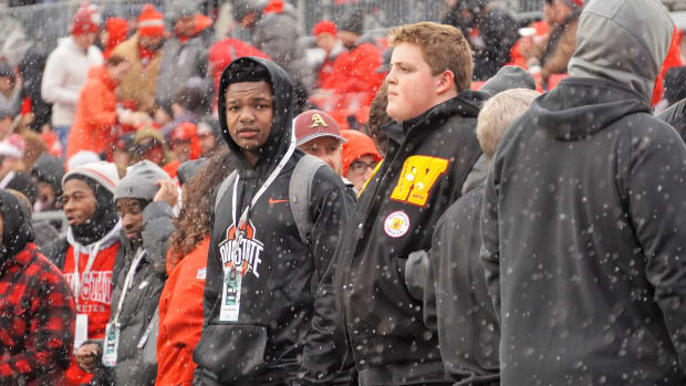 Tight end Ethan Barbour, left, watches Ohio State warm up prior to the Buckeyes' game against Indiana in 2023.