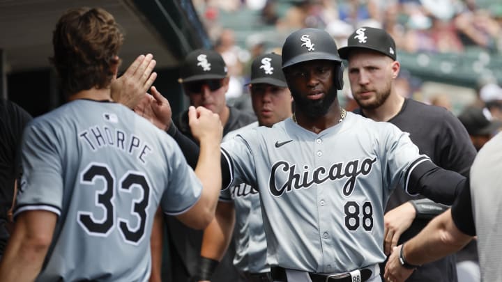 Chicago White Sox center fielder Luis Robert Jr. (88) receives congratulations from teammates after scoring in the fourth inning against the Detroit Tigers at Comerica Park on June 22.