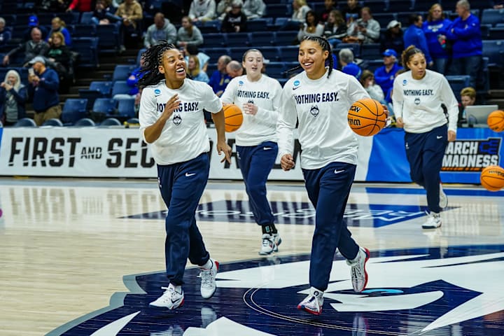 UConn Huskies guards Azzi Fudd and KK Arnold and teammates warm up before the start of the game against South Dakota State.