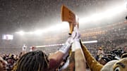Nov 29, 2025; Minneapolis, Minnesota, USA; Minnesota Golden Gophers celebrate with Paul Bunyan’s Axe after the game against the Wisconsin Badgers at Huntington Bank Stadium. Mandatory Credit: Matt Krohn-Imagn Images