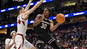 Mar 12, 2025; Nashville, TN, USA;  South Carolina Gamecocks forward Collin Murray-Boyles (30) passes the ball under the arms of Arkansas Razorbacks forward Zvonimir Ivisic (44) during the second half at Bridgestone Arena. Mandatory Credit: Steve Roberts-Imagn Images
