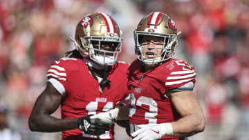 San Francisco 49ers wide receiver Brandon Aiyuk (L) and running back Christian McCaffrey (R)