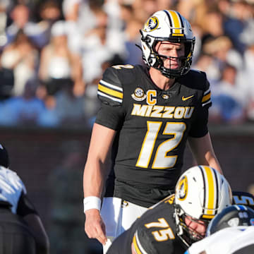 Sep 7, 2024; Columbia, Missouri, USA; Missouri Tigers quarterback Brady Cook (12) readies for the snap against the Buffalo Bulls during the first half at Faurot Field at Memorial Stadium. Mandatory Credit: Denny Medley-Imagn Images