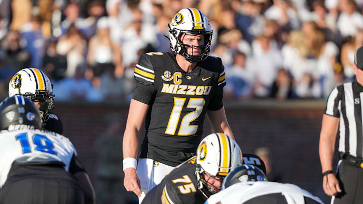 Sep 7, 2024; Columbia, Missouri, USA; Missouri Tigers quarterback Brady Cook (12) readies for the snap against the Buffalo Bulls during the first half at Faurot Field at Memorial Stadium. Mandatory Credit: Denny Medley-Imagn Images