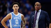 Dec 2, 2025; Lexington, Kentucky, USA; North Carolina Tar Heels head coach Hubert Davis talks with guard Kyan Evans (0) during the second half against the Kentucky Wildcats at Rupp Arena at Central Bank Center. Mandatory Credit: Jordan Prather-Imagn Images