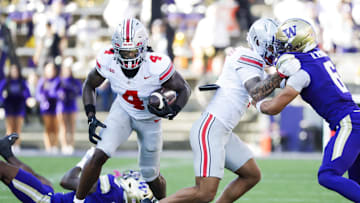 Sep 27, 2025; Seattle, Washington, USA; Ohio State Buckeyes wide receiver Jeremiah Smith (4) runs for yards after the catch against the Washington Huskies during the third quarter at Husky Stadium. Mandatory Credit: Joe Nicholson-Imagn Images