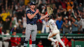 Boston, Massachusetts, USA; Tampa Bay Rays pitcher Ryan Pepiot (44) looks on as Boston Red Sox shortstop Trevor Story (10) hits a home run in the sixth inning at Fenway Park.