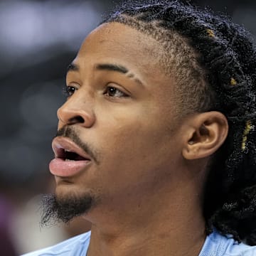 Dec 23, 2023; Atlanta, Georgia, USA; Memphis Grizzlies guard Ja Morant (12) warms up on the court prior to the game against the Atlanta Hawks at State Farm Arena. Mandatory Credit: Dale Zanine-Imagn Images