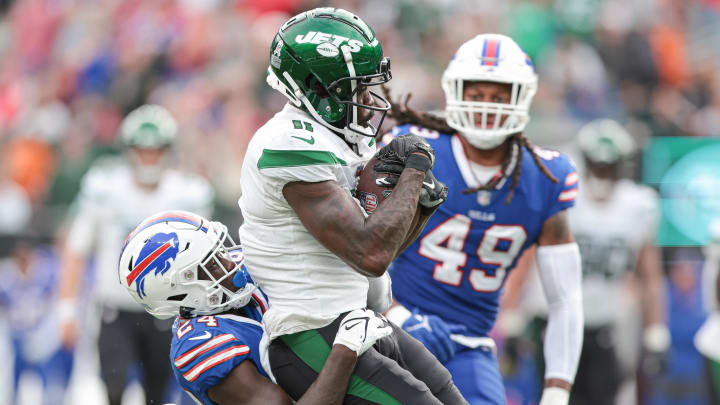 Nov 6, 2022; East Rutherford, New Jersey, USA; New York Jets wide receiver Denzel Mims (11) catches the ball as Buffalo Bills] cornerback Kaiir Elam (24) tackles during the second half at MetLife Stadium. Mandatory Credit: Vincent Carchietta-USA TODAY Sports