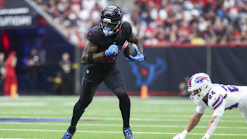 Oct 6, 2024; Houston, Texas, USA; Houston Texans wide receiver Nico Collins (12) runs with the ball after a reception during the first quarter against the Buffalo Bills at NRG Stadium. Mandatory Credit: Troy Taormina-Imagn Images