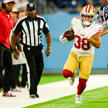 Aug 10, 2024; Nashville, Tennessee, USA;  San Francisco 49ers running back Cody Schrader (38) runs the ball against the Tennessee Titans during the second half at Nissan Stadium. Mandatory Credit: Steve Roberts-Imagn Images