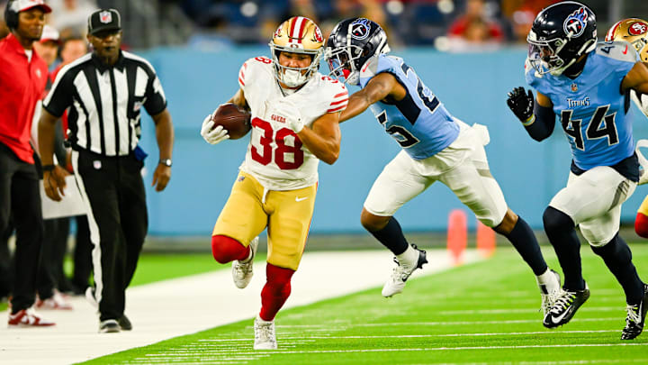 Aug 10, 2024; Nashville, Tennessee, USA;  San Francisco 49ers running back Cody Schrader (38) runs the ball against the Tennessee Titans during the second half at Nissan Stadium. Mandatory Credit: Steve Roberts-Imagn Images