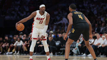 Apr 26, 2025; Miami, Florida, USA; Miami Heat center Bam Adebayo (13) dribbles the basketball as Cleveland Cavaliers forward Evan Mobley (4) defends in the third quarter during game three for the first round of the 2025 NBA Playoffs at Kaseya Center. Mandatory Credit: Sam Navarro-Imagn Images