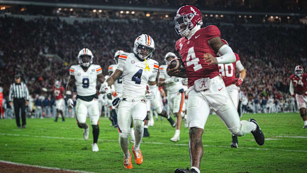 Alabama Crimson Tide quarterback Jalen Milroe scores a touchdown against the Auburn Tigers.