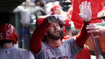 Jul 6, 2024; Chicago, Illinois, USA; Los Angeles Angels outfielder Taylor Ward (3) is greeted after scoring against the Chicago Cubs during the third inning at Wrigley Field. Mandatory Credit: David Banks-USA TODAY Sports