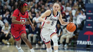 Feb 12, 2025; Storrs, Connecticut, USA; UConn Huskies guard Paige Bueckers (5) returns the ball against St. John's Red Storm guard Lashae Dwyer (13) in the second half at Harry A. Gampel Pavilion. Mandatory Credit: David Butler II-Imagn Images