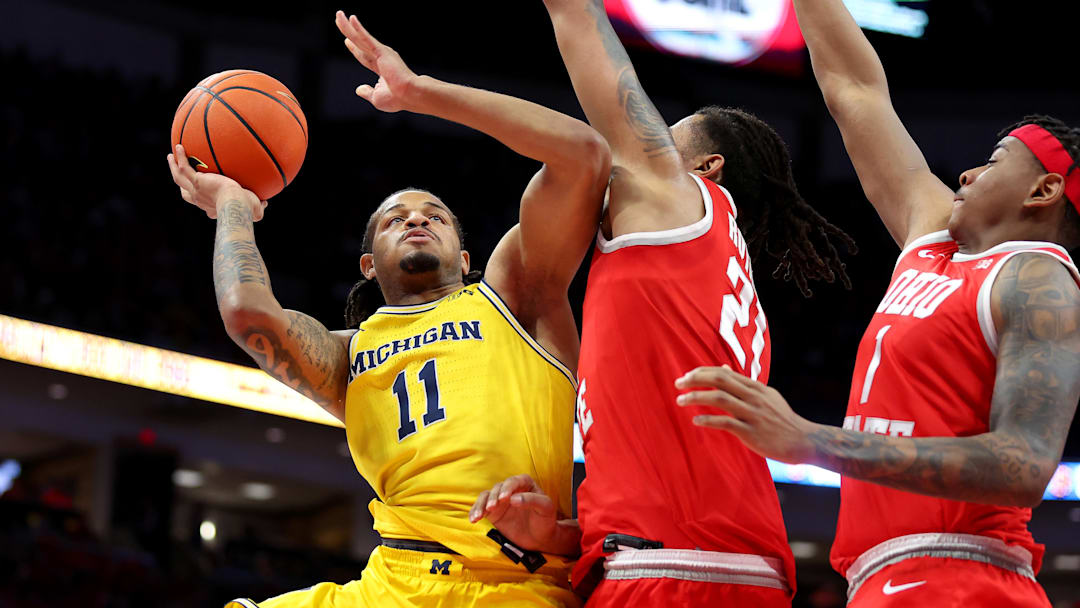 Feb 8, 2026; Columbus, Ohio, USA;  Michigan Wolverines guard Roddy Gayle Jr. (11) drives to the basket as Ohio State Buckeyes forward Devin Royal (21) defends during the first half at Value City Arena. Mandatory Credit: Joseph Maiorana-Imagn Images
