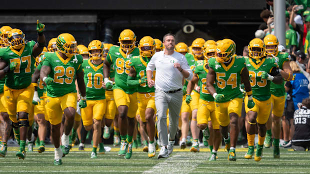 Oregon head coach Dan Lanning leads his team onto the field as the Oregon Ducks host the Montana State Bobcats on Aug. 30, 20