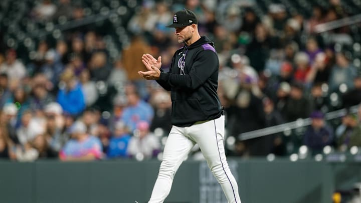 May 19, 2025; Denver, Colorado, USA; Colorado Rockies interim manager Warren Schaeffer (34) walks to mound for a pitching change in the eighth inning against the Philadelphia Phillies at Coors Field. Mandatory Credit: Isaiah J. Downing-Imagn Images