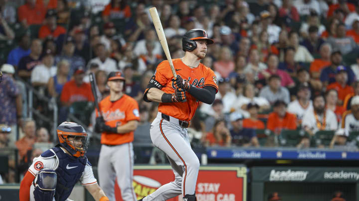 Jun 22, 2024; Houston, Texas, USA; Baltimore Orioles left fielder Ryan O'Hearn (32) hits a single during the third inning against the Houston Astros at Minute Maid Park. Mandatory Credit: Troy Taormina-USA TODAY Sports
