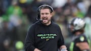 Oct 25, 2025; Eugene, Oregon, USA; Oregon Ducks head coach Dan Lanning instructs players during the first half against the Wisconsin Badgers at Autzen Stadium. Mandatory Credit: Troy Wayrynen-Imagn Images