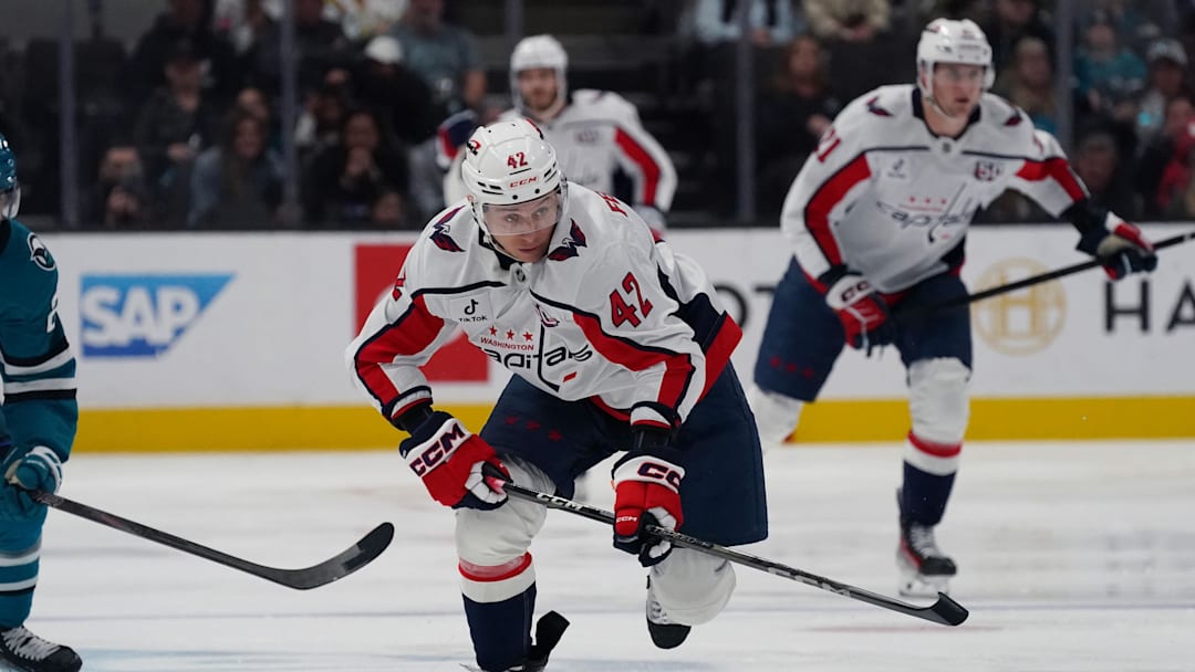 Mar 15, 2025; San Jose, California, USA;  Washington Capitals defenseman Martin Fehervary (42) advances the puck in the first period against the San Jose Sharks at SAP Center at San Jose. Mandatory Credit: David Gonzales-Imagn Images