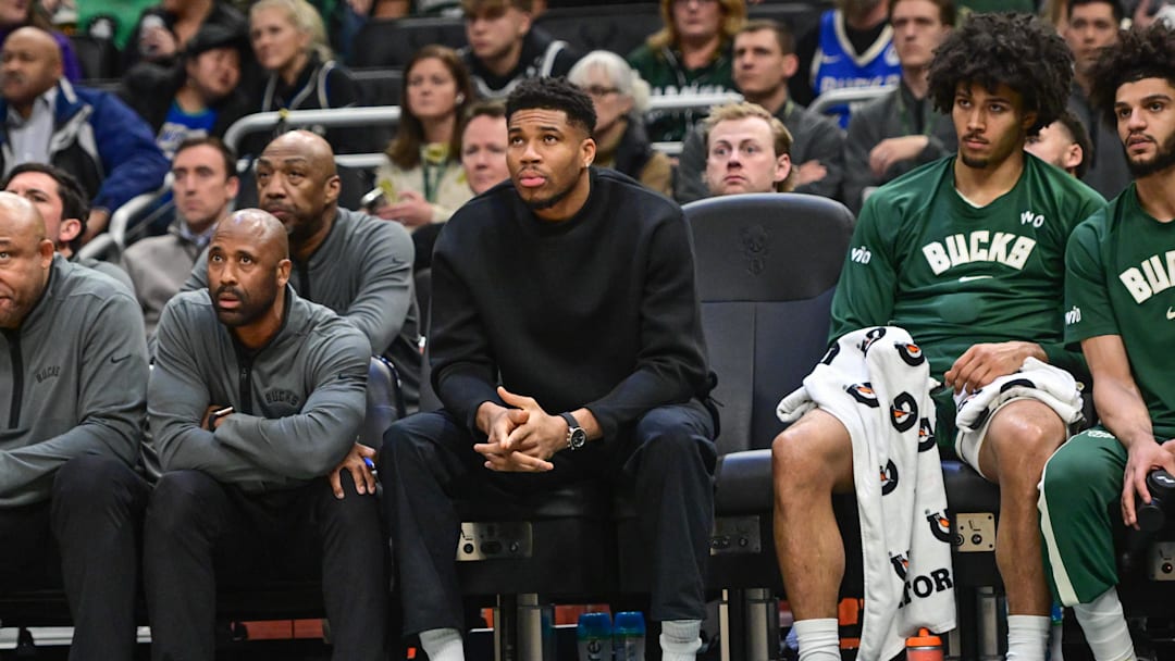 Dec 11, 2025; Milwaukee, Wisconsin, USA; Milwaukee Bucks forward Giannis Antetokounmpo (34) watches the game against the Boston Celtics from the bench in the second quarter at Fiserv Forum. Mandatory Credit: Benny Sieu-Imagn Images