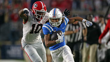 Nov 9, 2024; Oxford, Mississippi, USA; Mississippi Rebels wide receiver Cayden Lee (19) runs after a catch as Georgia Bulldogs linebacker Damon Wilson II (10) pursues during the second half at Vaught-Hemingway Stadium. Mandatory Credit: Petre Thomas-Imagn Images