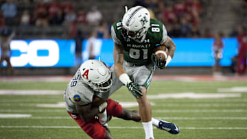 Sep 17, 2016; Tucson, AZ, USA; Hawaii Warriors wide receiver Kalakaua Timoteo (81) is tackled by Arizona Wildcats cornerback Devin Holiday (13) during the third quarter at Arizona Stadium. Mandatory Credit: Casey Sapio-Imagn Images