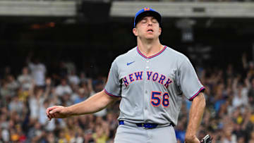 Aug 10, 2025; Milwaukee, Wisconsin, USA; New York Mets pitcher Ryan Helsley (56) reacts after giving up the tying run in the eighth inning against the Milwaukee Brewers at American Family Field. Mandatory Credit: Benny Sieu-Imagn Images