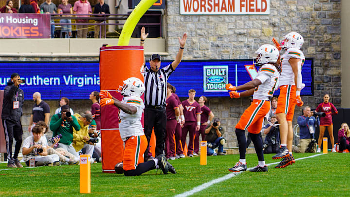 Nov 22, 2025; Blacksburg, Virginia, USA; Miami (FL) Hurricanes tight end Elija Lofton (9) celebrates after scoring a touchdown against the Virginia Tech Hokies during the first quarter at Lane Stadium. Mandatory Credit: Neville E. Guard-Imagn Images