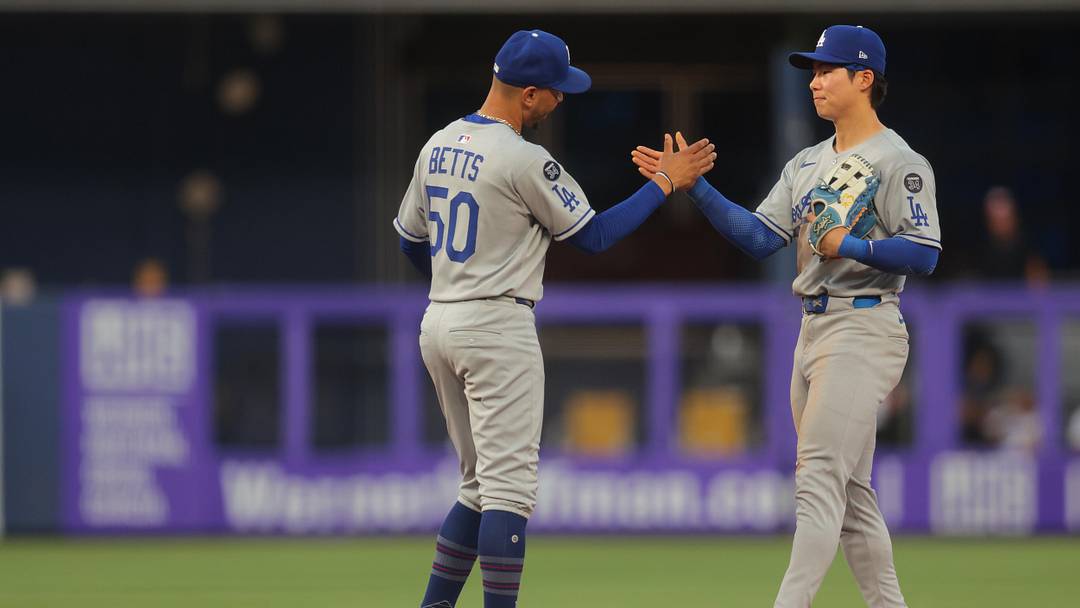 May 7, 2025; Miami, Florida, USA; Los Angeles Dodgers shortstop Mookie Betts (50) celebrates with second baseman Hyeseong Kim (6) after the game against the Miami Marlins at loanDepot Park. Mandatory Credit: Sam Navarro-Imagn Images