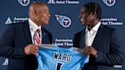 NFL Hall of Fame quarterback Warren Moon, left, poses for pictures with Cam Ward who earlier had been introduced as the Tennessee Titans first-round pick.