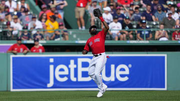 Jul 31, 2022; Boston, Massachusetts, USA; Boston Red Sox center fielder Jackie Bradley Jr. (19) catches a fly ball hit by Milwaukee Brewers catcher Victor Caratini (not pictured) during the ninth inning at Fenway Park. Mandatory Credit: Gregory Fisher-USA TODAY Sports