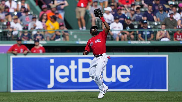 Jul 31, 2022; Boston, Massachusetts, USA; Boston Red Sox center fielder Jackie Bradley Jr. (19) catches a fly ball hit by Milwaukee Brewers catcher Victor Caratini (not pictured) during the ninth inning at Fenway Park. Mandatory Credit: Gregory Fisher-USA TODAY Sports