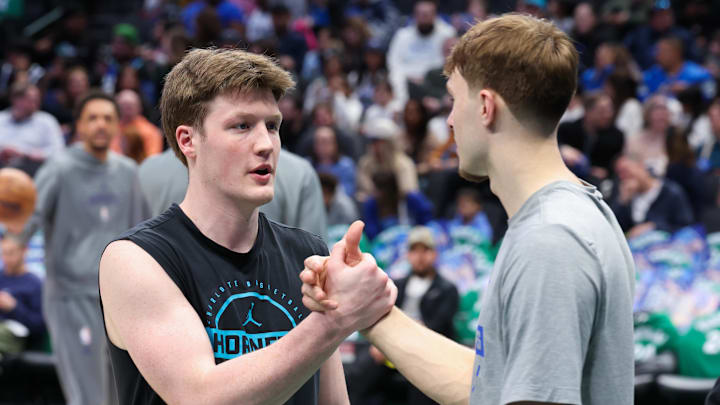 Jan 29, 2026; Dallas, Texas, USA; Dallas Mavericks forward Cooper Flagg (right) speaks with Charlotte Hornets guard Kon Knueppel (left) before the game at American Airlines Center. Mandatory Credit: Kevin Jairaj-Imagn Images