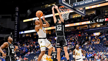 Mar 13, 2025; Nashville, TN, USA; Missouri Tigers guard Tony Perkins (12) drives to the basket against the Mississippi State Bulldogs during the first half at Bridgestone Arena. Mandatory Credit: Steve Roberts-Imagn Images