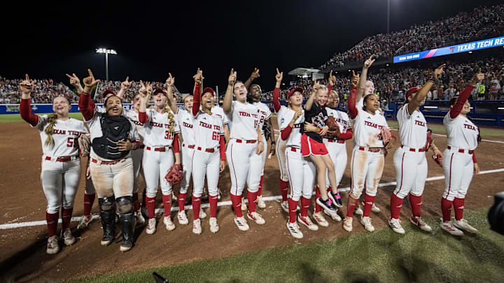 Jun 5, 2025; Oklahoma City, OK, USA;  Texas Tech Red Raiders players cheer towards the fans after defeating the Texas Longhorns in the NCAA Softball Women's College World Series finals at Devon Park. Mandatory Credit: Brett Rojo-Imagn Images