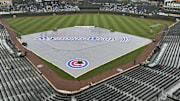 The tarp is on the field before the teams game against the St. Louis Cardinals at Wrigley Field. 