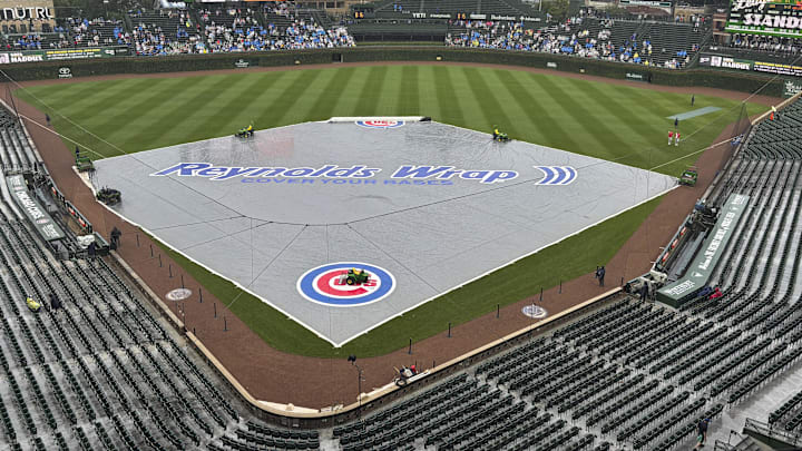 The tarp is on the field before the teams game against the St. Louis Cardinals at Wrigley Field. The tarp is on the field before the teams game against the St. Louis Cardinals at Wrigley Field.