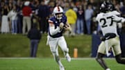 Nov 8, 2025; Charlottesville, Virginia, USA; Virginia Cavaliers quarterback Daniel Kaelin (10) runs with the ball against the Wake Forest Demon Deacons during the first half at Scott Stadium. Mandatory Credit: Amber Searls-Imagn Images