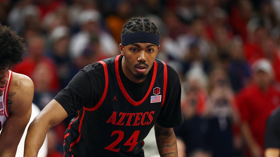 Dec 20, 2025; Phoenix, Arizona, USA; San Diego State Aztecs guard Taj DeGourville (24) against the Arizona Wildcats during the Hall of Fame Series at Mortgage Matchup Center.