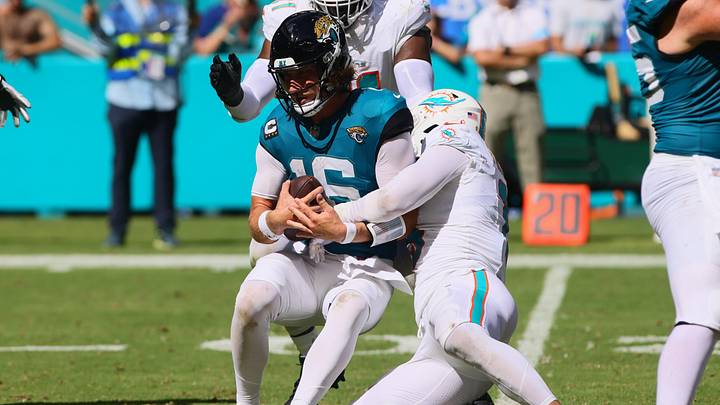 Sep 8, 2024; Miami Gardens, Florida, USA; Miami Dolphins linebacker Jaelan Phillips (15) sacks Jacksonville Jaguars quarterback Trevor Lawrence (16) during the fourth quarter at Hard Rock Stadium. Mandatory Credit: Sam Navarro-Imagn Images
