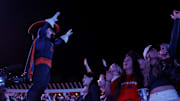 Nov 8, 2025; Charlottesville, Virginia, USA; Virginia Cavaliers mascot “Cav Man” sings with students in the stands during the second half against the Wake Forest Demon Deacons at Scott Stadium. Mandatory Credit: Amber Searls-Imagn Images