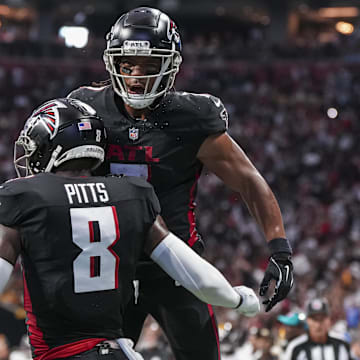 Atlanta Falcons tight end Kyle Pitts (8) reacts with running back Bijan Robinson (7) 