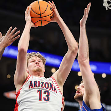 Arizona Wildcats forward Henri Veesaar (13) rebounds during the first half against the Kansas Jayhawks at T-Mobile Center. 