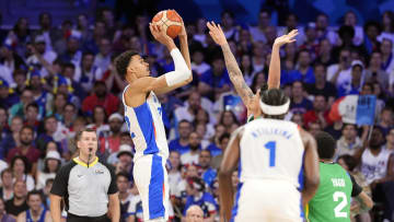 Jul 27, 2024; Villeneuve-d'Ascq, France; France power forward Victor Wembanyama (32) shoots against Brazil during the Paris 2024 Olympic Summer Games at Stade Pierre-Mauroy. Mandatory Credit: John David Mercer-USA TODAY Sports