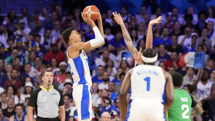 Jul 27, 2024; Villeneuve-d'Ascq, France; France power forward Victor Wembanyama (32) shoots against Brazil during the Paris 2024 Olympic Summer Games at Stade Pierre-Mauroy. Mandatory Credit: John David Mercer-USA TODAY Sports