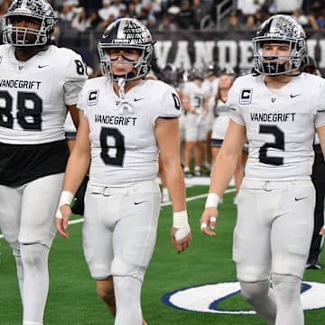 Austin Vandegrift's captains walk to midfield during the 6A DII UIL Texas State Football Championship game against Southlake Carroll on Saturday, December 21, 2024 at AT&T Stadium in Arlington. The Vipers are in the quarterfinals this year again. 